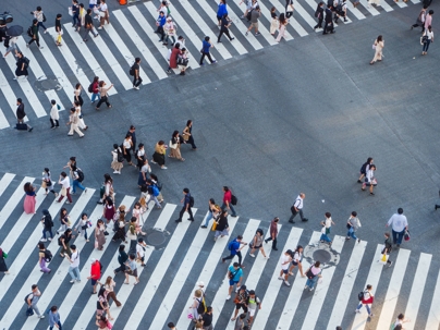 groups of people crossing crosswalks
